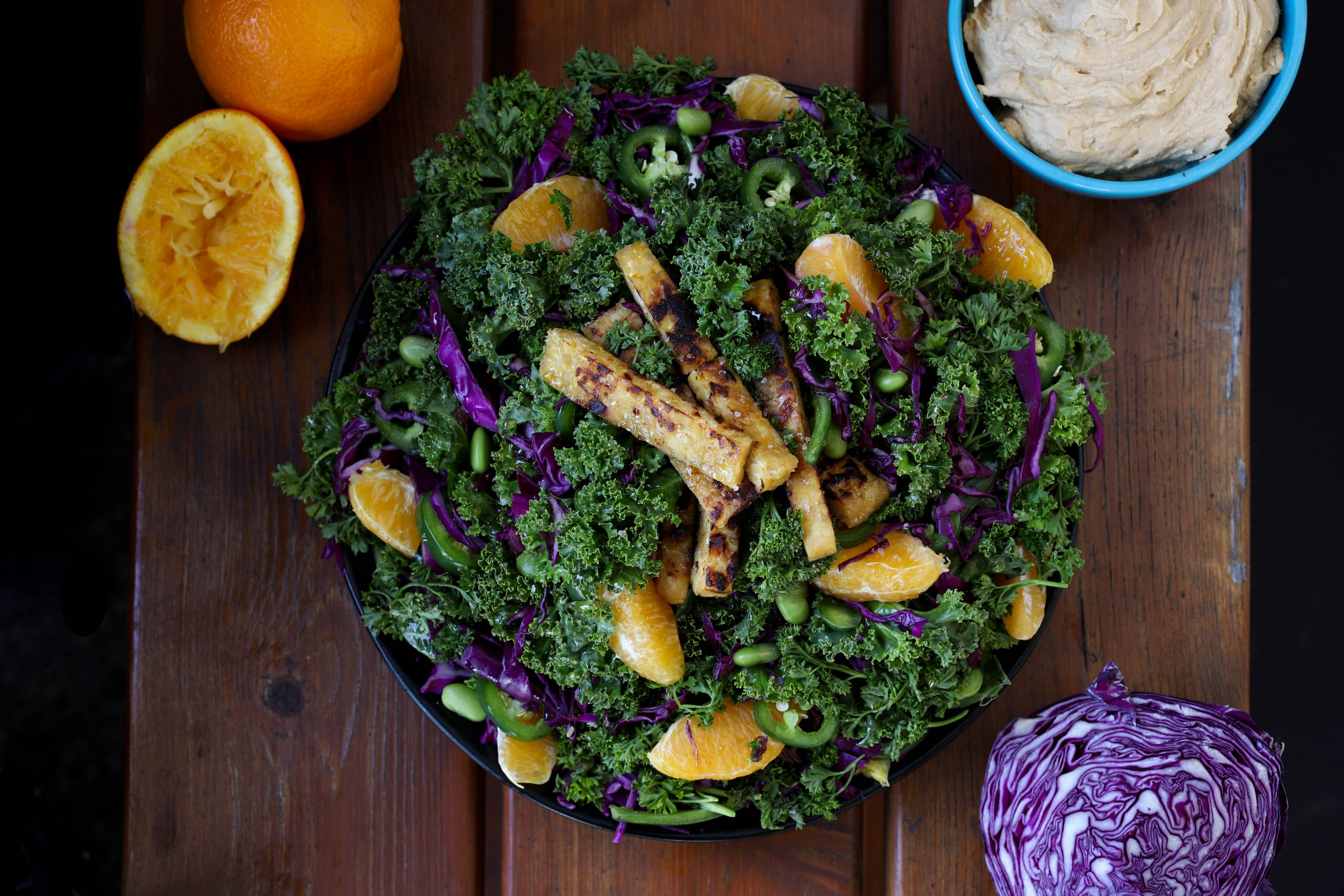 citrus marinated tempeh salad with kale and hummus